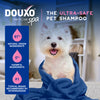 A dog in a towel, with text above reading DOUXO Skin and Coat SPA, the ultra-safe pet shampoo.