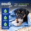 A puppy in a towel, with text above reading DOUXO Skin and Coat SPA, the ultra-safe pet shampoo.